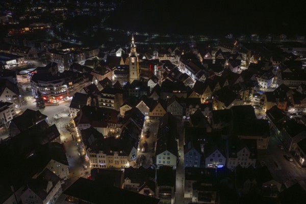 Night panorama of a city with a centrally located, illuminated church tower, Nagold, Calw district, Germany