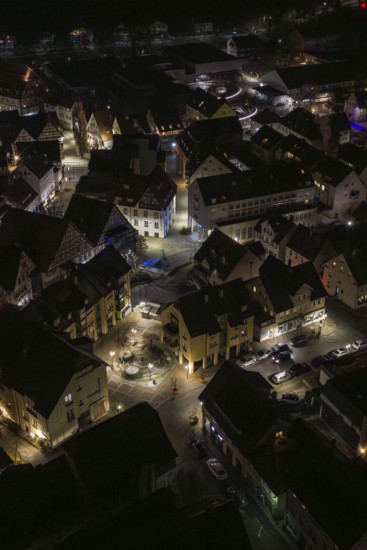 Aerial view of a city at night with illuminated streets and buildings, Nagold, Calw district, Germany