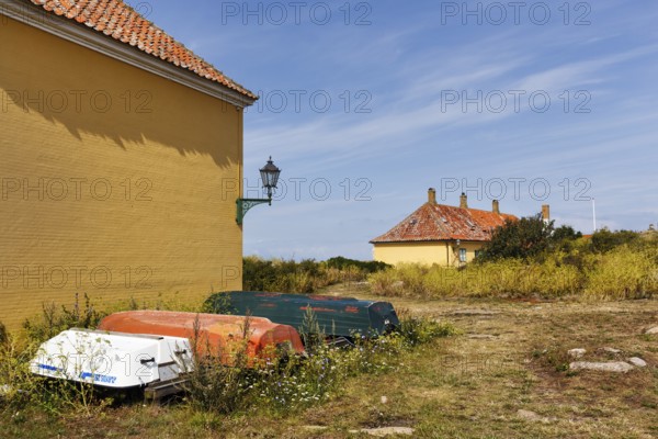 Rural coastal landscape, traditional buildings, state prison for political prisoners, three boats, Cirrus, FrederiksÃ¶, Ertholmene, Pea Islands, Bornholm, Denmark