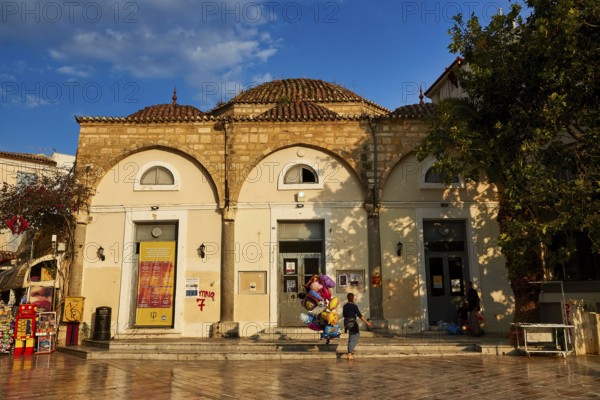 Old town of Nauplion, historic building with round dome and decorated doors, surrounded by trees, Nauplion, Nafplion, Peloponnese, Greece