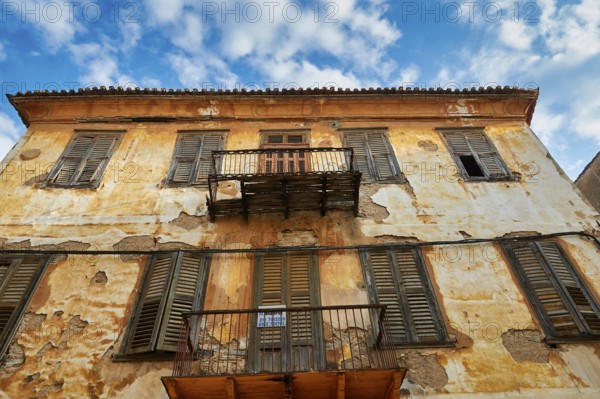Old town of Nauplion, weathered faÃ§ade of an old building with balconies, under a clear sky, Nauplion, Nafplion, Peloponnese, Greece