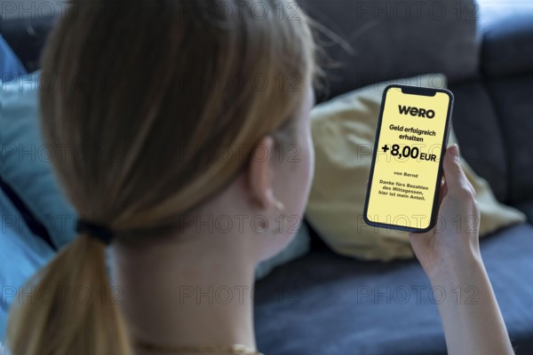 Symbol image, photo montage, to the European WERO payment service, sending or receiving money directly to another person, P2P, person-to-person