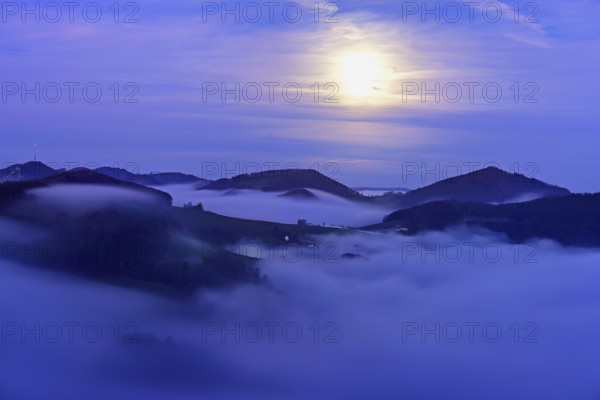 View from the Gisliflue of the Jurassic foothills covered in fog from the left, Wasserfluh, Summerholde, Asperstrihen, Strihen, in the light of a full moon, Talheim, Canton, Aargau, Switzerland