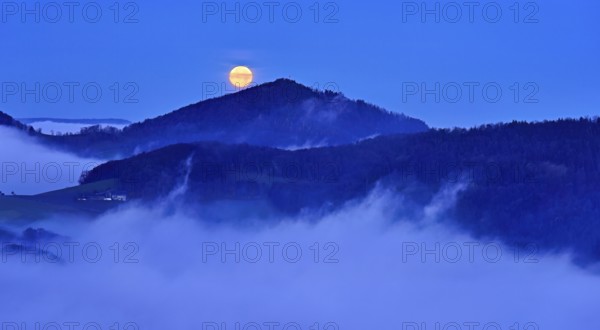 View from the Gisliflue of the Jura foothills of Strihen, covered in fog, in the light of the full moon, Talheim, Canton, Aargau, Switzerland
