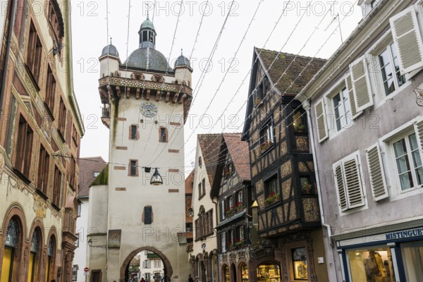 Clock tower and artfully painted half-timbered houses, Tour de l'Horloge, SÃ©lestat, Schlettstadt, Alsace, Bas-Rhin department, France
