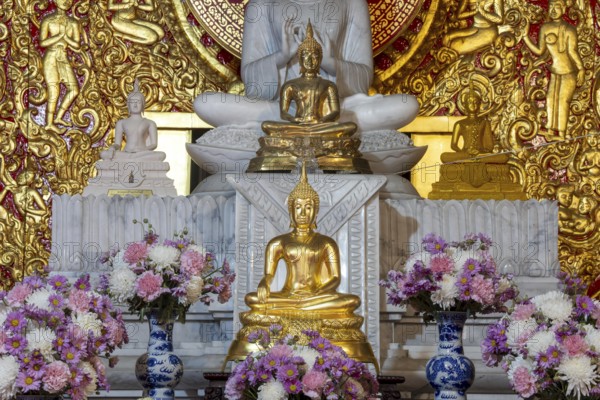 Various Buddha statues, Bhumispara mudra, Buddha Gautama at the moment of enlightenment, as well as meditating and teaching, Wat Sitthawararam, Bangkok, Thailand