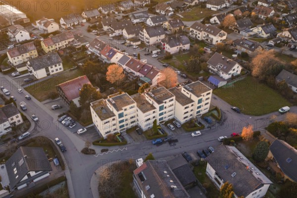 View of apartment buildings in a suburban neighborhood with parked cars, Althengstett, Calw district, Germany