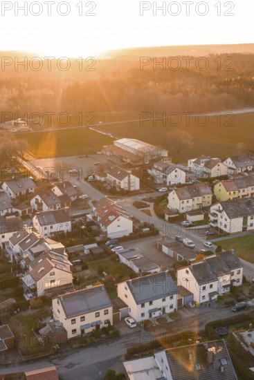 Suburb with houses and streets, illuminated by the evening sun, surrounded by nature, Althengstett, Calw district, Germany