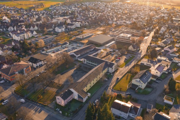 Aerial view of a small village at sunset with a cozy atmosphere, Althengstett, Calw district, Germany