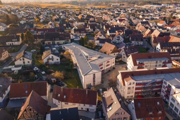 Aerial view of a village with many residential buildings and a community building, Althengstett, Calw district, Germany