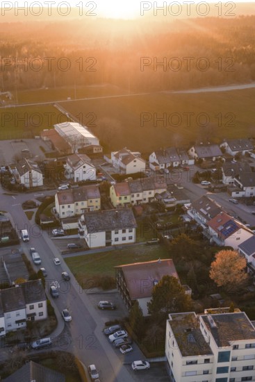 Aerial view of houses in a village at atmospheric sunset, Althengstett, Calw district, Germany