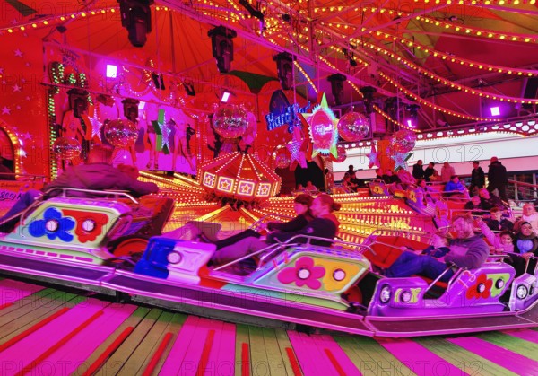 People on the Musik-Express ride at the All Saints Fair, the biggest old town fair in Europe, Soest, North Rhine-Westphalia, Germany