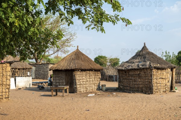 Typical village with mud huts, locals, Caprivi strip, Namibia
