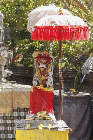 Demon, figure in Pura Dalem Penataran Taman, Sanur, Bali, Indonesia