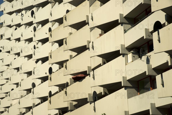 High-rise apartment building with balconies and satellite dishes, satellite town of Chorweiler in Cologne, North Rhine-Westphalia, Germany