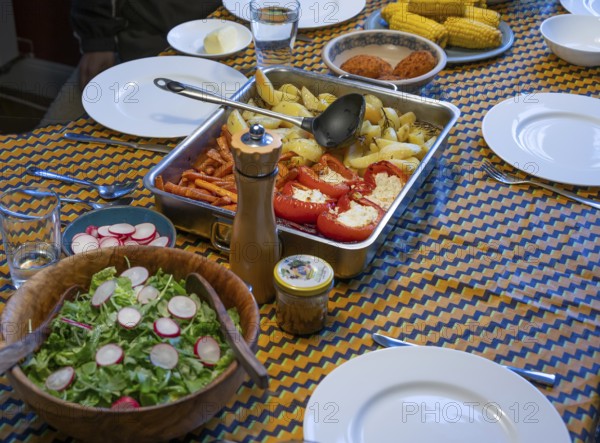 Different dishes on a set table, Mecklenburg-Vorpommern, Germany