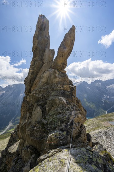 Crocodile rock formation with sun star, via ferrata Krokodil-Bergsee am Bergseeschijen-Vorbau, GÃ¶scheneralp, Canton of Uri, Switzerland
