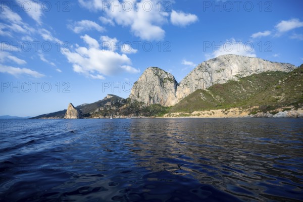 Picturesque rocky coast, cliffs with Pedra Longa pinnacle, blue sea, Golfo di Orosei, Baunei, Sardinia, Italy