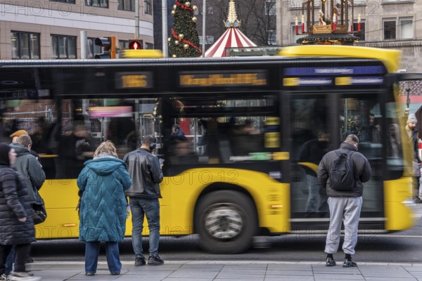Bus station at Essen main station, Ruhrbahn bus leaves, passers-by wait, Essen, North Rhine-Westphalia, Germany