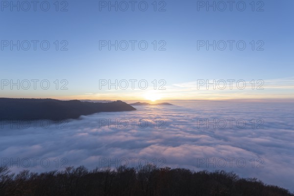 Sunset over the sea of fog from Beurener Fels to Hohenneuffen Castle, Swabian Alb, Baden-WÃ¼rttemberg, Germany