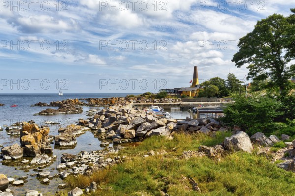 Coastline with granite rocks and sailboat, Hammerknuden, Allinge, Bornholm, Denmark