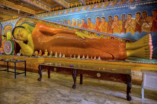 Reclining Buddha statue in Isurumuniya Rajamaha Viharaya temple, Anuradhapura, Sri Lanka