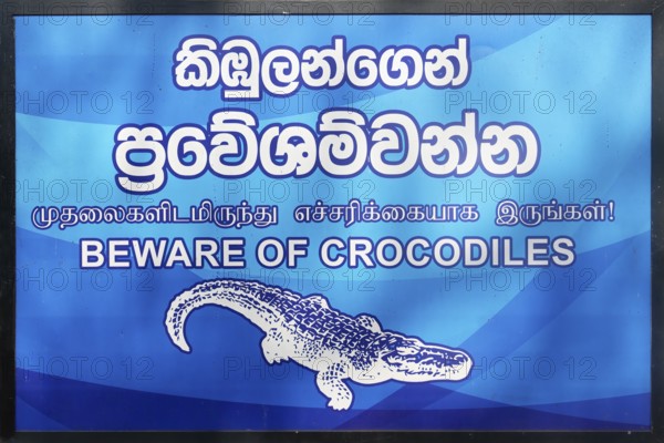 Signpost announcing Beware of crocodiles, Anuradhapura, Sri Lanka