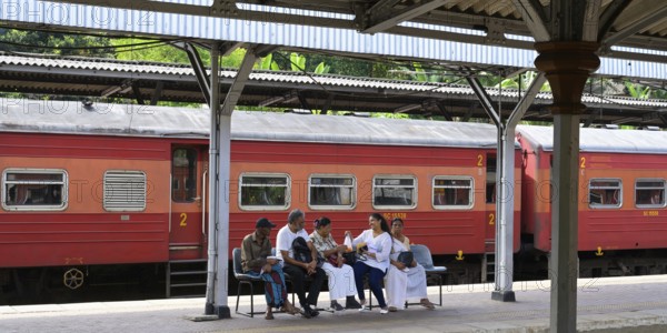 People waiting on the train platform, Kandy Railway Station, Sri Lanka