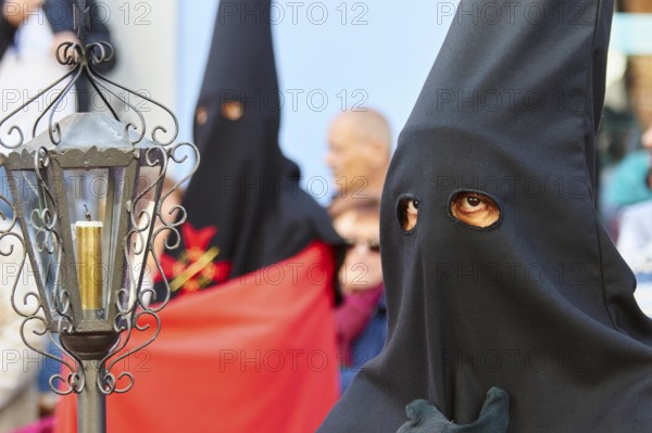 Good Friday procession, religious procession with participants in black robes, UNESCO World Heritage Old Town of San Crstobal de La Laguna, La Laguna, Tenerife, Canary Islands, Spain