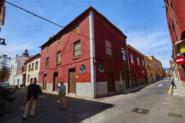 Historic street with red facades in sunshine, UNESCO World Heritage Old Town of San Crstobal de La Laguna, La Laguna, Tenerife, Canary Islands, Spain