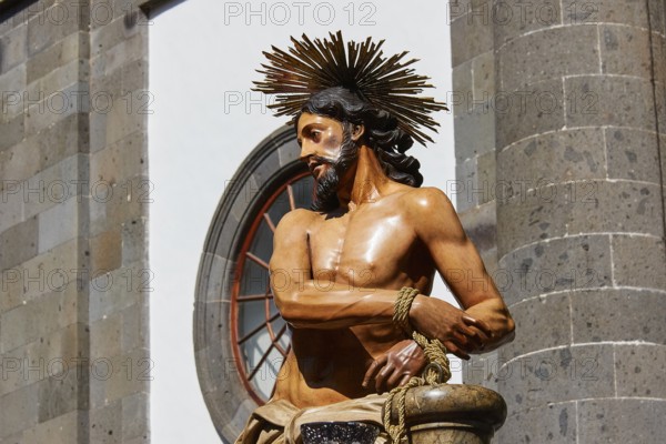 Good Friday procession, Christ statue in front of a stone building in sunlight, UNESCO World Heritage Old Town of San Crstobal de La Laguna, La Laguna, Tenerife, Canary Islands, Spain