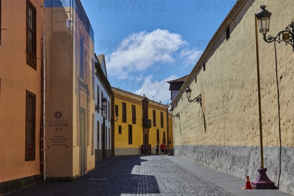 Painted street scene with historic buildings under blue sky, UNESCO World Heritage Old Town of San Crstobal de La Laguna, La Laguna, Tenerife, Canary Islands, Spain