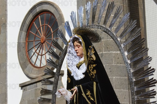Good Friday procession, statue of Saint Mary in magnificent clothing against a church background, UNESCO World Heritage Old Town of San Crstobal de La Laguna, La Laguna, Tenerife, Canary Islands, Spain