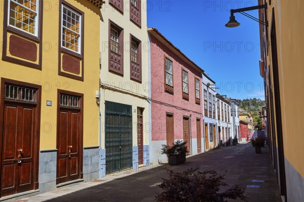 Narrow alley with colorful painted classic buildings and sunny weather, UNESCO World Heritage Old Town of San Crstobal de La Laguna, La Laguna, Tenerife, Canary Islands, Spain