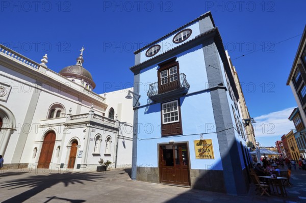 Blue building next to a historic domed church in the shadow of another building, UNESCO World Heritage Old Town of San Crstobal de La Laguna, La Laguna, Tenerife, Canary Islands, Spain