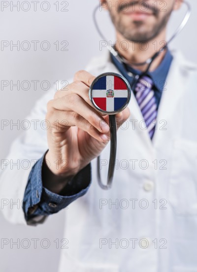 Dominican Republic health and medical insurance concept. Dominican Republic healthcare system, doctor holding stethoscope