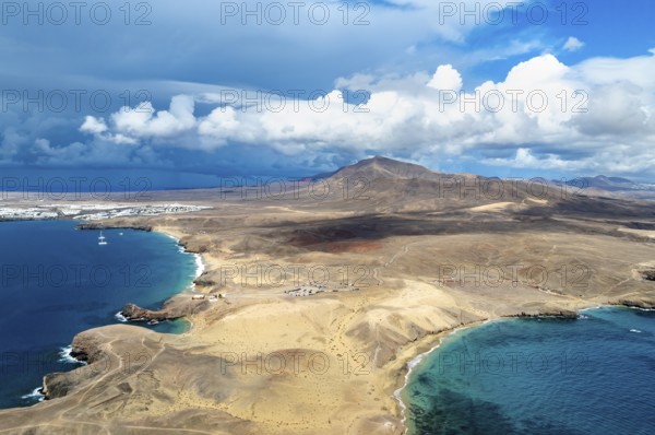 Headland and blue sea, coastal landscape, arid landscape of Los Ajaches Natural Park, aerial view, Lanzarote, Canary Islands, Spain