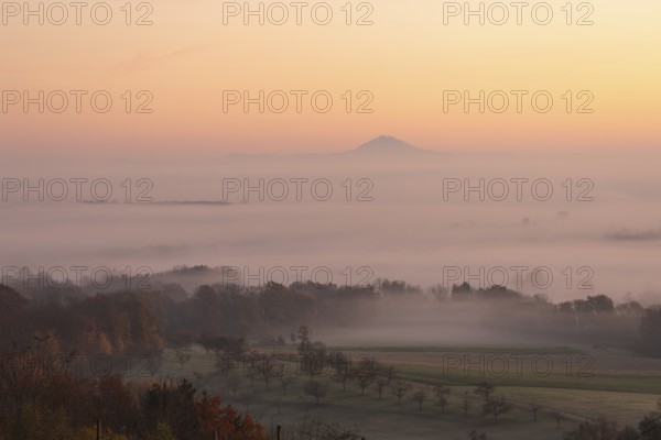 Hohenstaufen in the golden morning light, Aichelberg. Spectacular dawn over the foggy foothills of Alb