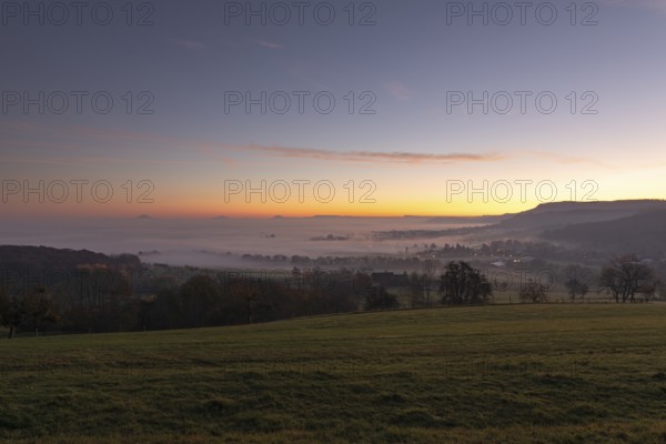 Three Kaiserberge mountains in golden morning light, Hohenstaufen, Aichelberg, spectacular dawn over the foggy foothills of Baden-WÃ¼rttemberg. Bad Boll, EckwÃ¤lden, DÃ¼rnau in the district Göppingen, Baden-WÃ¼rttemberg, Germany