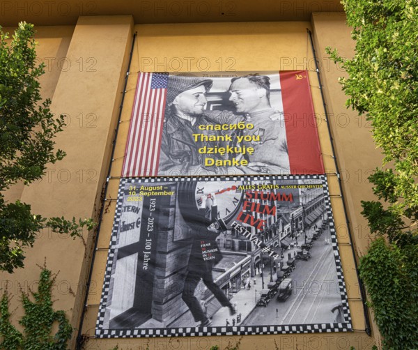 Film posters at the cult cinema Babylon on Rosa Luxemburg Platz, arthouse cinema opened in 1929, some of whose films are accompanied by a live orchestra, Berlin, Germany