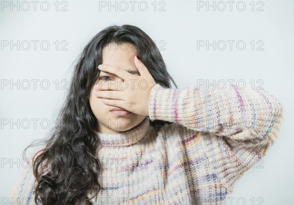 Close up of woman with conjunctivitis isolated. Female with eye infection looking at camera