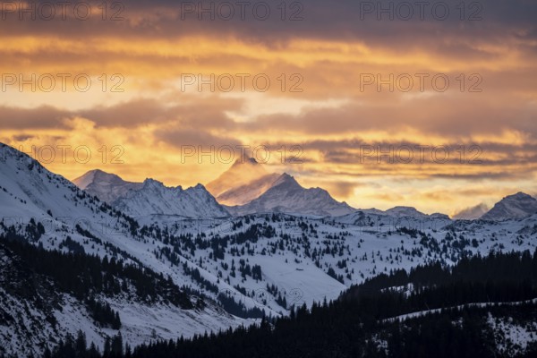 Grossglockner peaks at sunset in winter, spectacular cloudy skies, Hochbrixen, Brixen im Thale, Tyrol, Austria