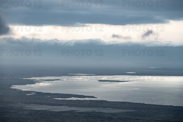 View of savanna landscape and Magadi Lake with clouds, view of Ngorongoro Crater, Ngorongoro Conservation Area, Tanzania