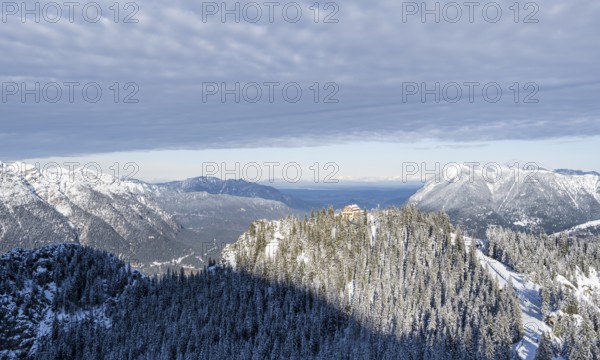 Snowy forest and Kreuzeckhaus mountain hut in the Garmisch Classic ski area in winter, Wetterstein Mountains, Garmisch-Partenkirchen, Bavaria, Germany