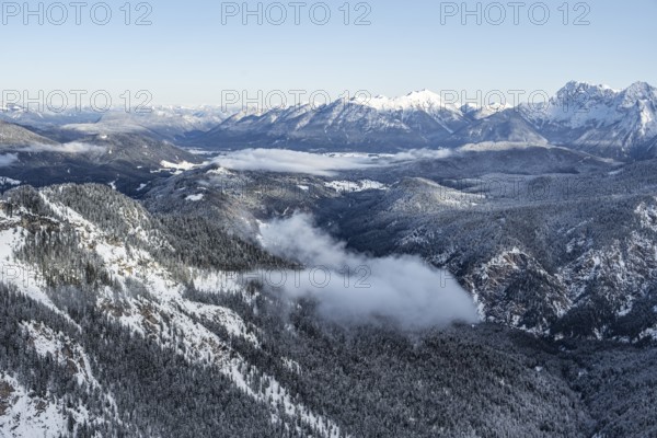 View of snow-covered mountain landscape across the Reintal towards the Estergebirge and Soierngruppe, view from LÃ¤ngenfelderkopf in winter, Wetterstein Mountains, Garmisch-Partenkirchen, Bavaria, Germany