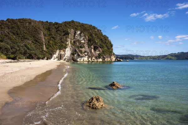 Landscape with sea and sandy beach in New Zealand. Lonely Bay, Shakespeare Cliff in the back, Cooks Beach, Coromandel Peninsula, Waikato, New Zealand