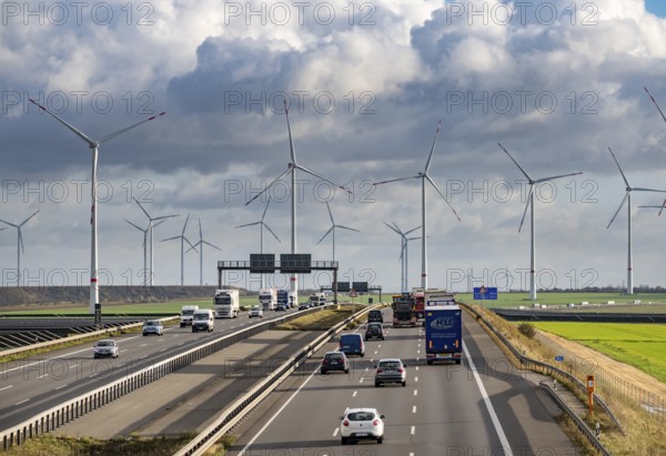 A44 motorway near Bedburg, in front of the Jackerath triangle, recultivated open-cast mining site, Garzweiler open-cast lignite mine, Königshovener Höhe wind farm near Bedburg, operated by RWE and the city of Bedburg, North Rhine-Westphalia, Germany
