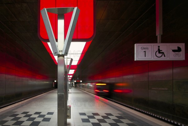 HafenCity University subway station, illuminated in color, red, underground train, movement effect, U4, empty, platform, stop, train station, subway, sign, boarding area wheelchair user, stroller, public transport, HVV, Hamburger Verkehrsverbund, Hochbahn, public transport, Free and Hanseatic City of Hamburg, Germany