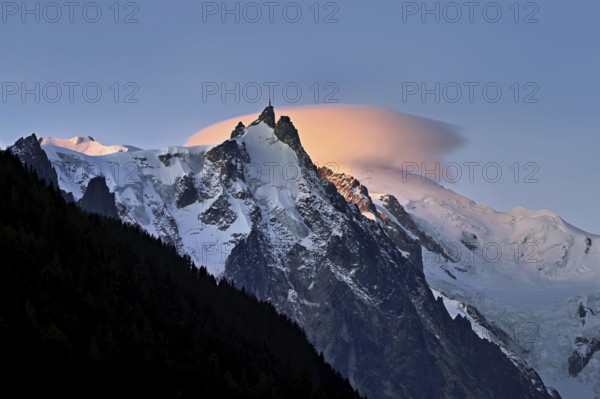 Aiguille du Midi with sun-lit cloud above the summit, Mont-Blanc, Chamonix-Mont-Blanc, Haute-Savoie, France
