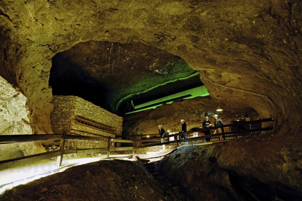 Four people in a tunnel in a salt mine, salt mine, Bex, Canton of Vaud, Switzerland